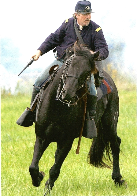 Major Milburn rides into action. 
Photo by Deb Edwards, Commercial News, Danville IL
